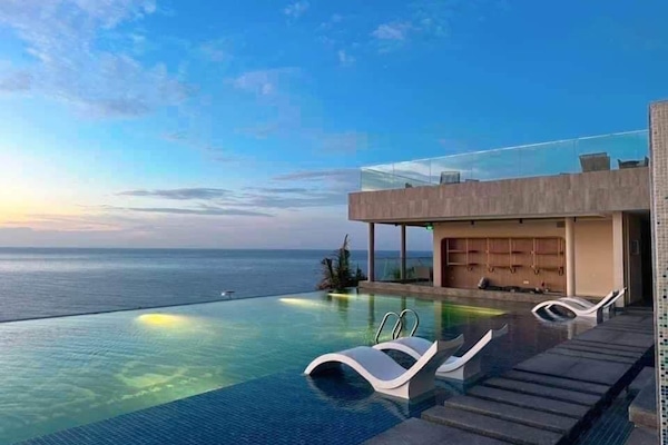 2 outdoor pools, open 6:00 AM to 8:00 AM, free cabanas, pool umbrellas