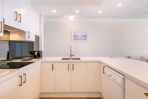 Electric kettle, toaster, cleaning supplies, freezer