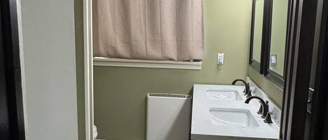 Hair dryer, towels, shampoo, toilet paper