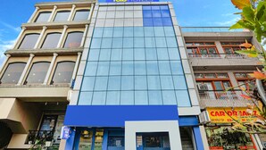A multi-story building with a prominent 'Fab Hotels' sign at the top. - Fabhotel Golden Key (New Delhi)
