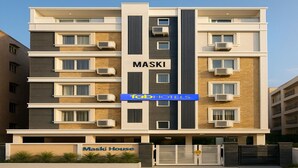 A multi-story hotel building named "Maski House" with a modern architectural design, featuring air conditioning units on each floor and a gated entrance. - Fabhotel Maski Suites (Hyderabad)