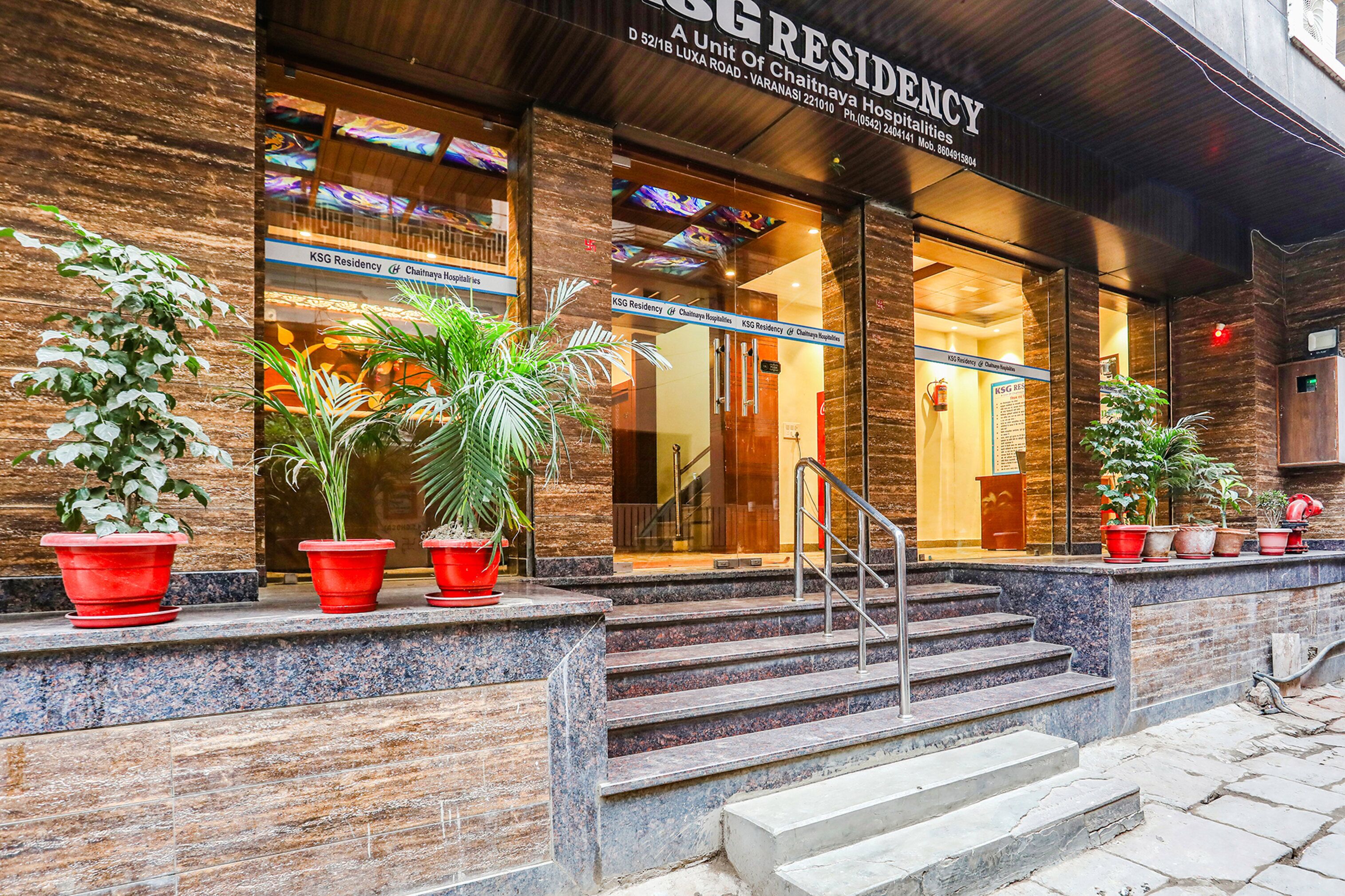A hotel entrance with a sign reading "KSG Residency".