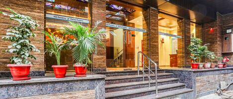 A hotel entrance with a sign reading "KSG Residency".