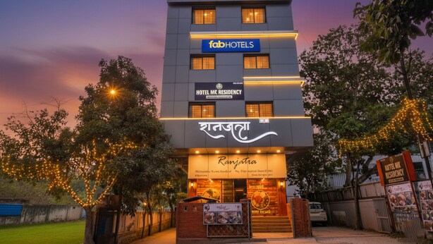 A multi-story hotel with signage for MK Residency and Fab Hotels. - Fabhotel Phoenix Inn (Pune)