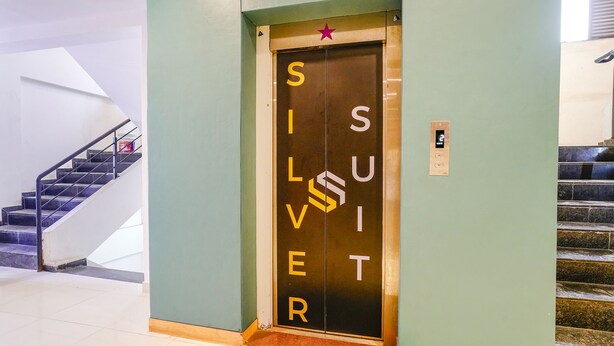 An elevator with the word "SILVER" and a star symbol on the door. - Fabhotel Silver Cloud (Mumbai)