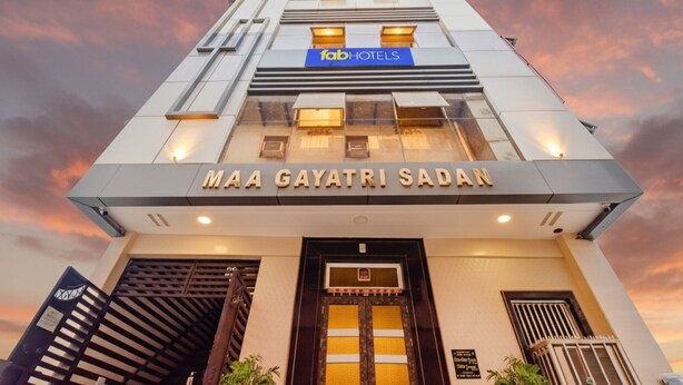 The facade of Maa Gayatri Sadan hotel with a modern design, featuring a prominent entrance and a sign for Fab Hotels. - Fabhotel Maa Gayatri Sadan (Mathura)