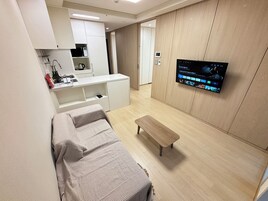 Family Twin Room, Non Smoking, Kitchen (self-service check-in) | Living area | Flat-screen TV