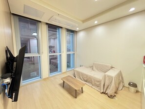 Family Twin Room, Non Smoking, Kitchen (self-service check-in) | Living area | Flat-screen TV