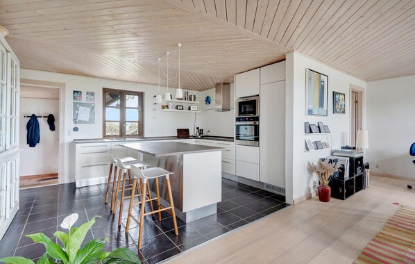 Fridge, stovetop, dishwasher, coffee/tea maker