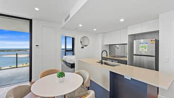 Two Bedroom Two Bathroom Water View Apartment | Living area | 50-inch Smart TV with digital channels