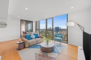 Two Bedroom Two Bathroom Hinterland View | Living area | 50-inch Smart TV with digital channels - Marine Quarter Apartments by CLLIX (Southport)