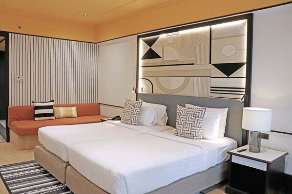 Superior Twin Room | Minibar, in-room safe, laptop workspace, blackout drapes