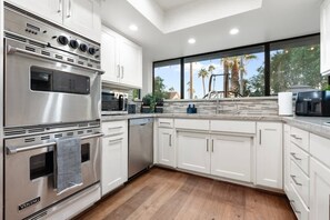 Coffee/tea maker, fridge, microwave, oven