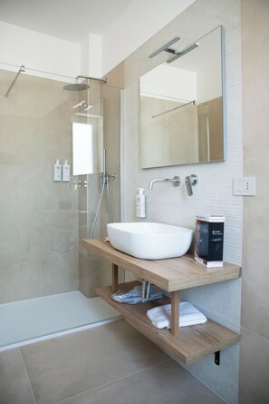 Shower, free toiletries, hair dryer, slippers