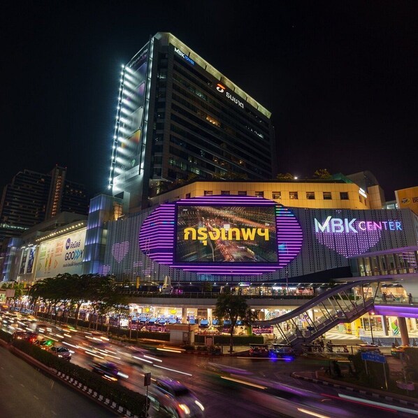A multi-story building with illuminated signage, including "MBK Center" and "GooY" on the facade. - Sathorn 111 (Bangkok)