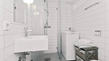 Shower, towels, soap, toilet paper