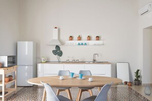 Classic Apartment, Balcony | Private kitchen | Full-sized fridge, oven, stovetop, espresso maker - Darsena Apartments by Wonderful Italy (Syracuse)