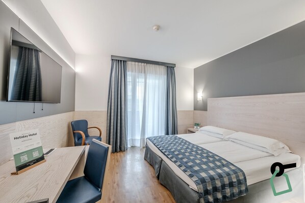 Comfort Double or Twin Room, Non Smoking | Minibar, desk, laptop workspace, free WiFi - Hotiday Room Collection - Torbole (Nago-Torbole)