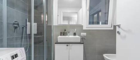 Hair dryer, bidet, towels, soap