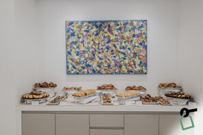 Indulge in a selection of freshly baked pastries and bread at our buffet.