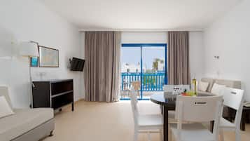 Apartment, 1 Bedroom, Balcony | Living area | TV