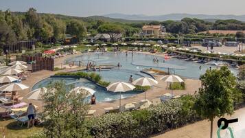 Seasonal outdoor pool, open 10:00 AM to 6:00 PM, pool umbrellas