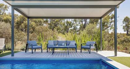 PICTURESQUE RURAL OASIS ON 6 ACRES BOASTS PANORAMIC BUSHLAND AND OCEAN VIEWS