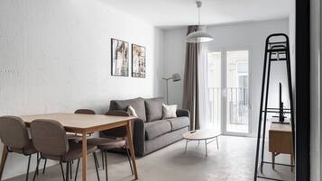 One-Bedroom Apartment with Terrace | Living area | 43-inch Smart TV with satellite channels