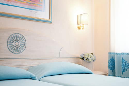 Triple Room, Balcony | Minibar, in-room safe