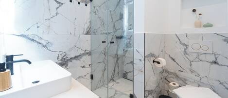 Premium Apartment, 1 Bedroom, Patio, Garden Area | Bathroom | Shower, free toiletries, hair dryer, towels