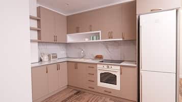 Full-sized fridge, oven, stovetop, high chair
