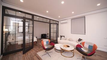 Luxury Apartment, 2 Bedrooms, Non Smoking, Kitchen | Living area | 65-inch LED TV with cable channels