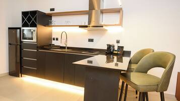 Fridge, microwave, stovetop, cookware/dishes/utensils