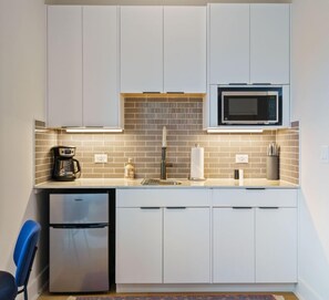 Fridge, microwave, coffee/tea maker, toaster