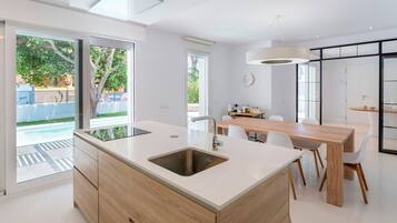 Villa (4 Bedrooms) | Private kitchen | Fridge, microwave, stovetop, dishwasher