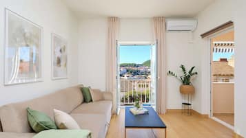 Apartment (1 Bedroom) | Living area | 108-cm Smart TV with cable channels