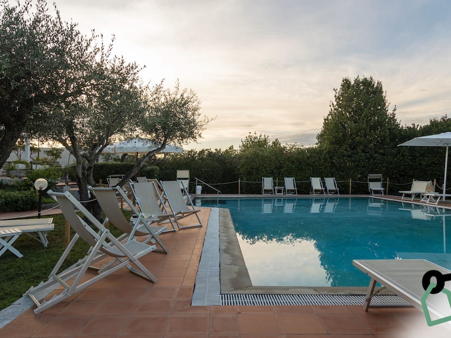 Seasonal outdoor pool, open 10:00 AM to 7:00 PM, pool umbrellas