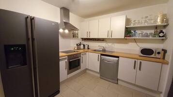 Apartment | Private kitchen | Fridge, microwave, oven, stovetop