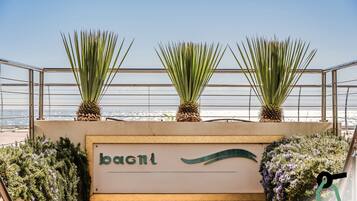 On the beach, sun loungers, beach umbrellas