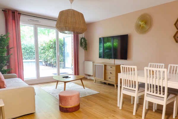 Deluxe Apartment, Garden View | Living area | 119-cm Smart TV with digital channels