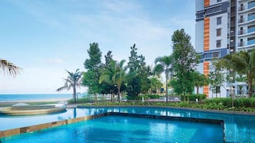 4 outdoor pools, open 8:30 AM to 10:00 PM, pool umbrellas, pool loungers