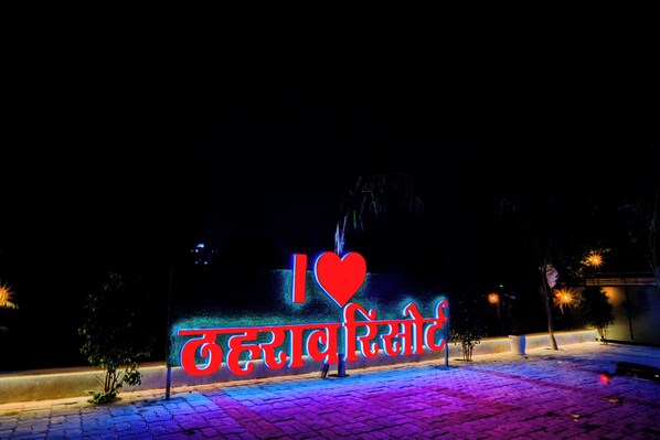 A nighttime scene with a neon sign that reads "I love Jaipur." - Theharav Resort (Jaipur)