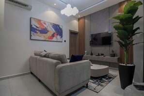 Family Apartment, Balcony, City View | Living area | Flat-screen TV - One90 Apartment  (Lagos)