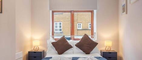 1 bedroom, desk, iron/ironing board, travel crib