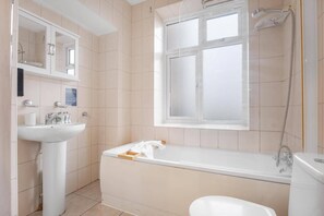 Shower, hair dryer, towels, shampoo
