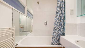 Hair dryer, towels, shampoo, toilet paper