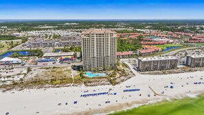 A high-rise hotel with a pool, beach, and surrounding residential area. - Grand Panama Resort Penthouse, 2 Pools, 3bd 3ba (Panama City Beach)