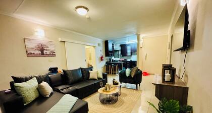 Cozy 2-bedroom apartment in the busy city of Gaborone with WiFi and A/C