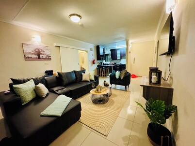 Cozy 2-bedroom apartment in the busy city of Gaborone with WiFi and A/C