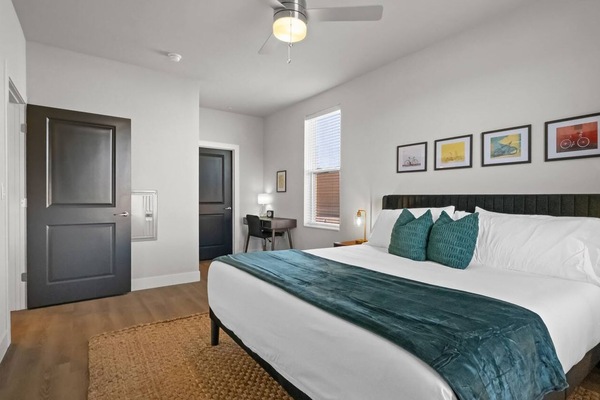 Step into the master suite, a luxurious haven designed for ultimate relaxation. Featuring a king-size bed adorned with soft, comfy blankets, this spacious retreat invites you to unwind and recharge.